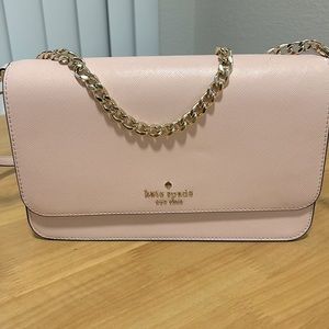 Pink Kate Spade purse w gold chain and interchangeable long pink leather strap.